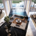 Open Concept Sunken Living Room Surrounded by Indoor Pool and Black Marble