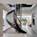 Spiral Staircase and Glass Elevator Breaking Through Transparent Floors
