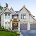 Blend of Stone and Shingle Style Home with Elegant Rooflines