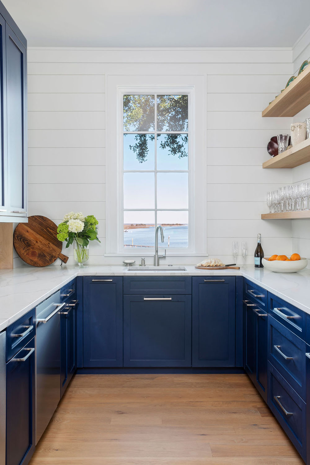 Coastal Style Waterfront Mansion - Isle of Palms, South Carolina Pantry with a View. Blue Kitchen Cabinet with Marble Countertop