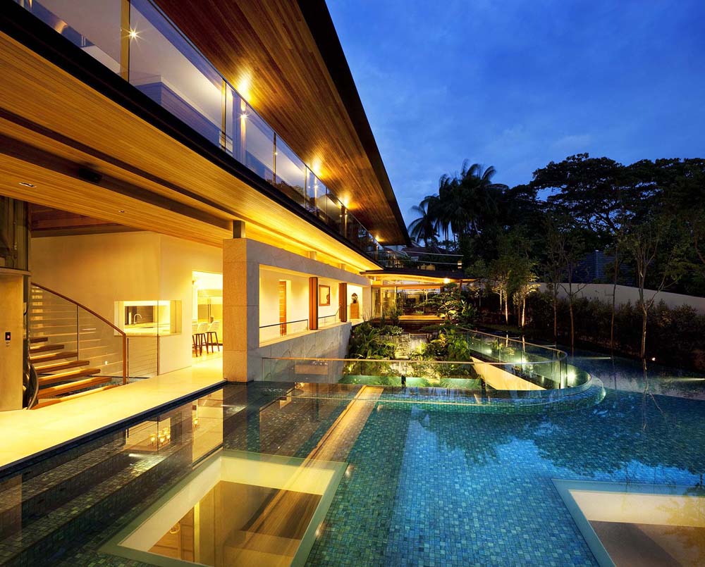 Modern Tropical Home in Singapore with Spiral Staircase Wrapped Around a Glass Elevator