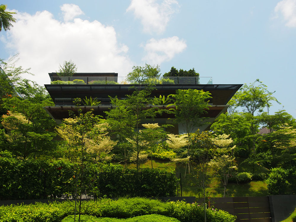 Modern Tropical Home in Singapore with Spiral Staircase Wrapped Around a Glass Elevator