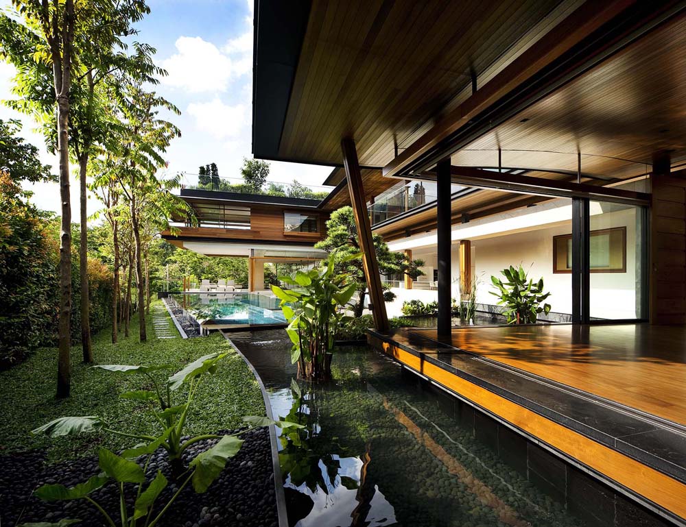 Modern Tropical Home in Singapore with Spiral Staircase Wrapped Around a Glass Elevator