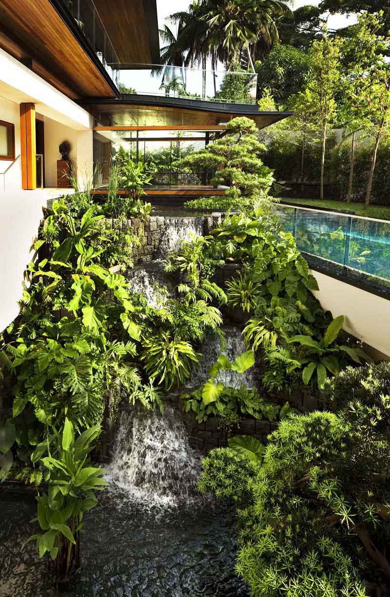 Modern Tropical Home in Singapore with Spiral Staircase Wrapped Around a Glass Elevator Tropical House with Waterfall