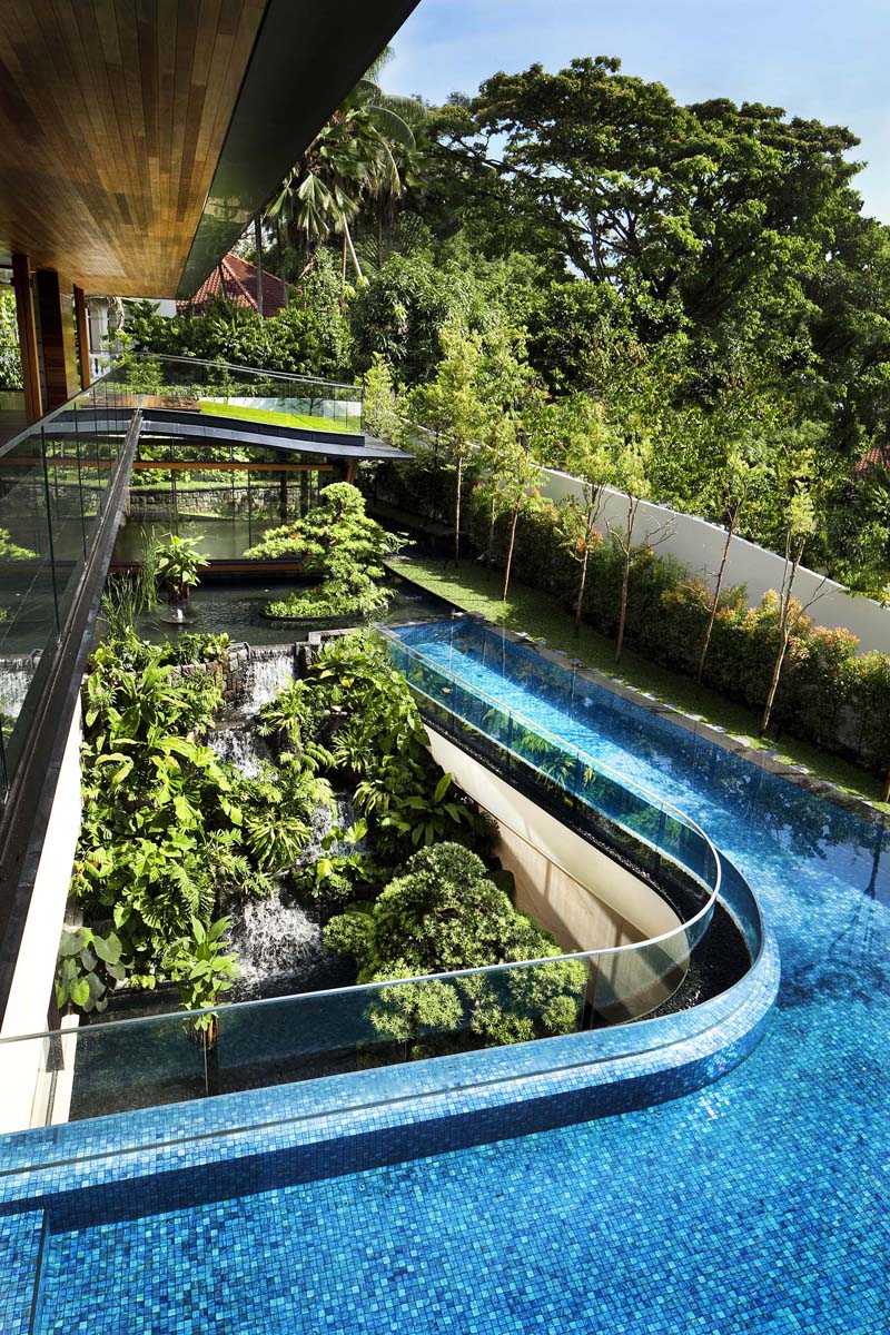 Modern Tropical Home in Singapore with Spiral Staircase Wrapped Around a Glass Elevator