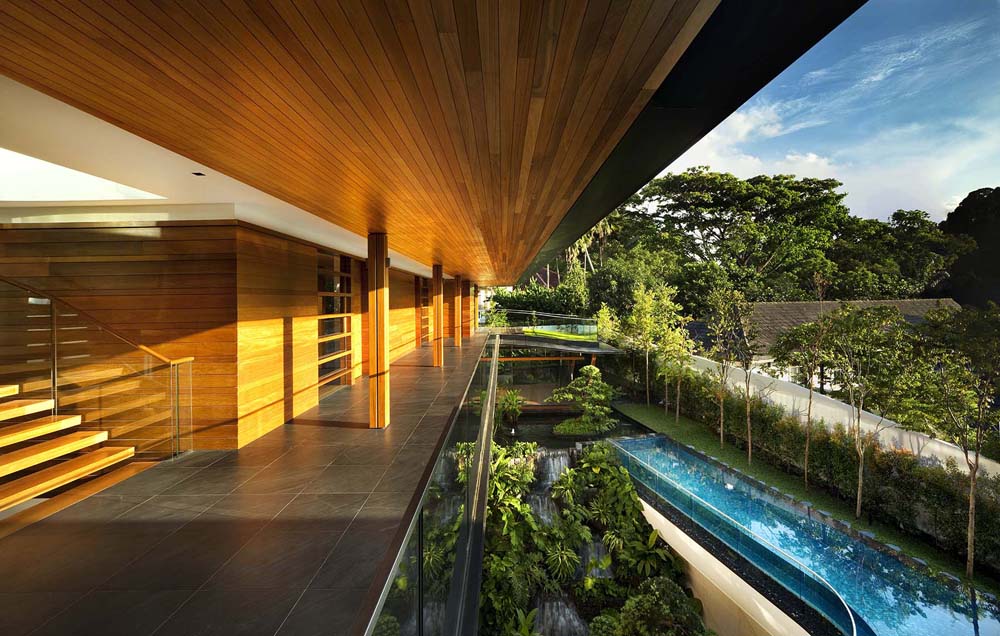 Modern Tropical Home in Singapore with Spiral Staircase Wrapped Around a Glass Elevator