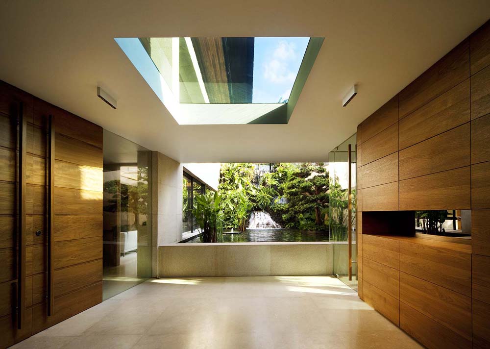 Modern Tropical Home in Singapore with Spiral Staircase Wrapped Around a Glass Elevator