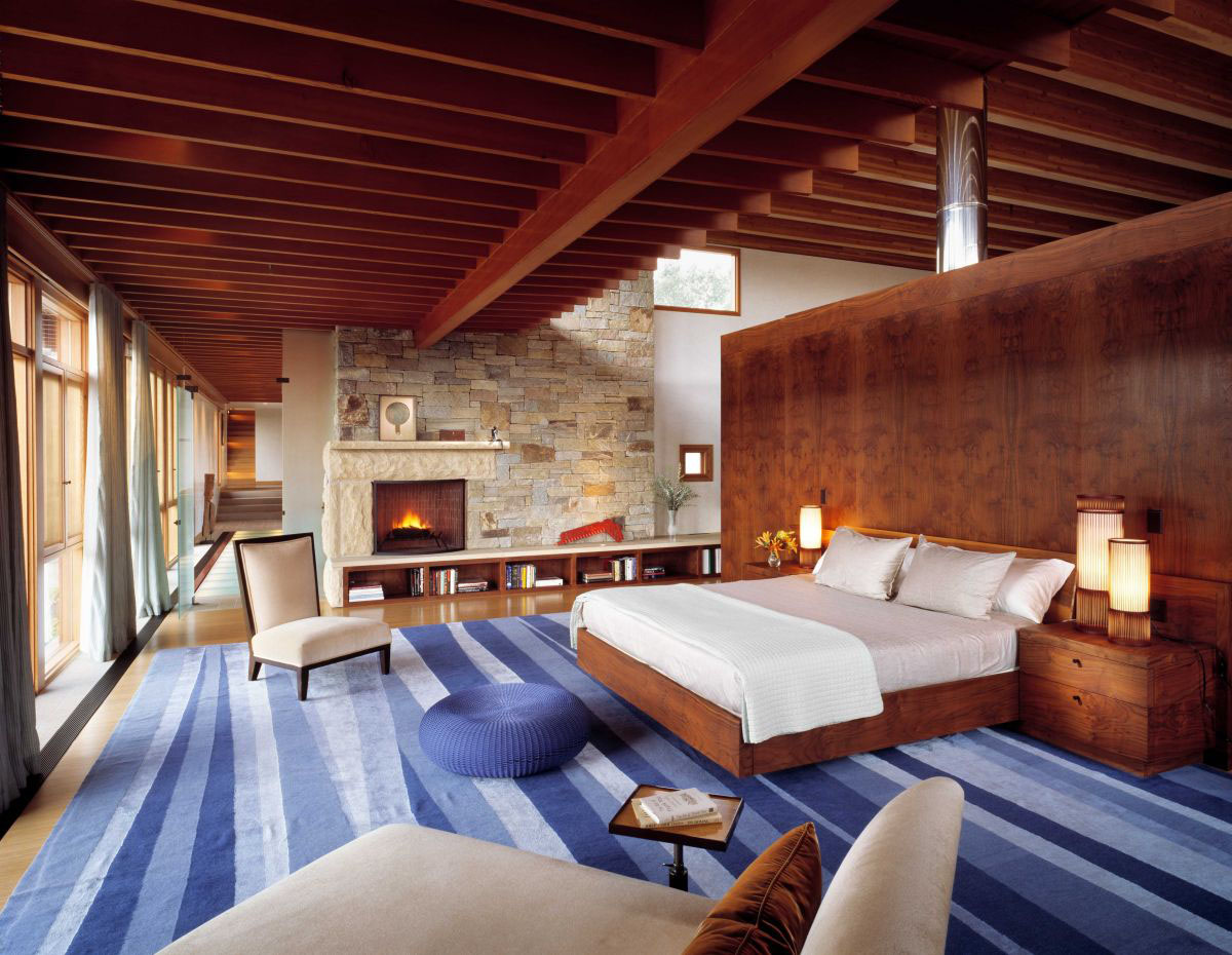 Contemporary-Stone-and-Wood-House_13 Bedroom with Wood Beams and Stone Wall