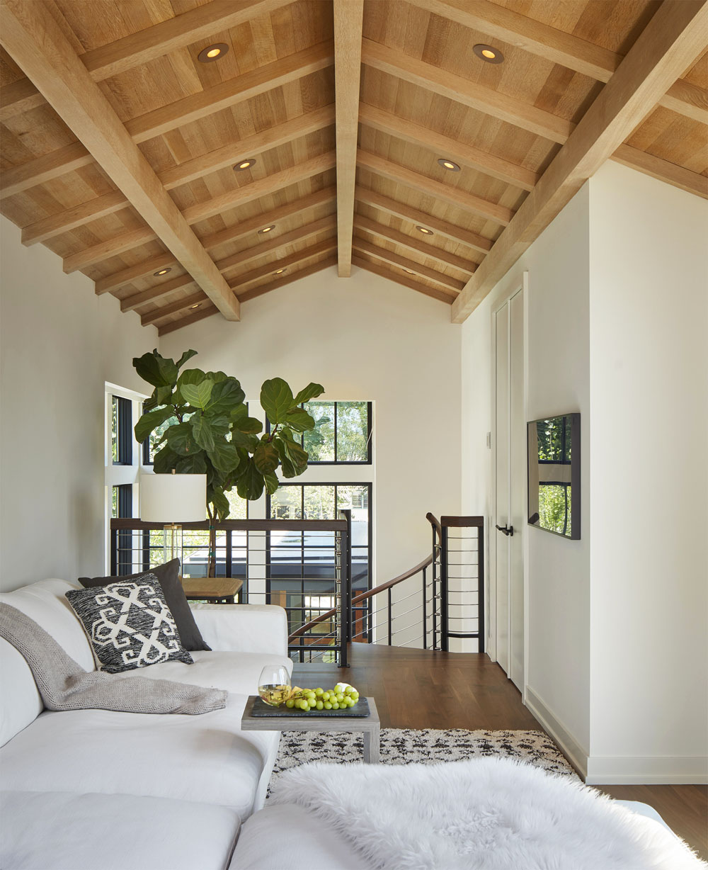 Lounge with Warm White Oak Timber Beams and Paneled Ceiling