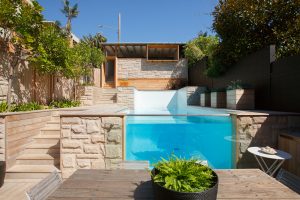 House with Transparent Backyard Swimming Pool