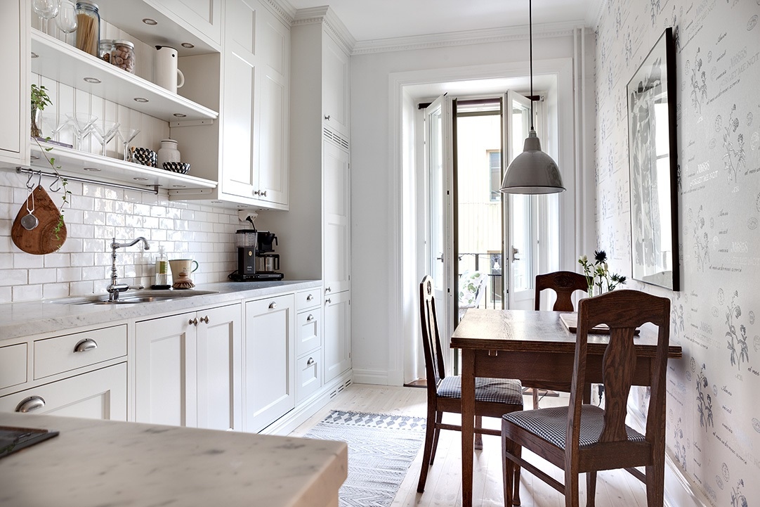 Refurbished-Apartment-Gothenburg_5 New White Kitchen Cabinet with Marble Countertop