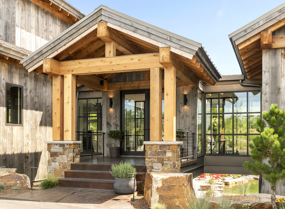 Modern Country Lodge with Private Pond - Afton, Minnesota Modern Country Lodge Front Entrance with Glass and Metal Bridge