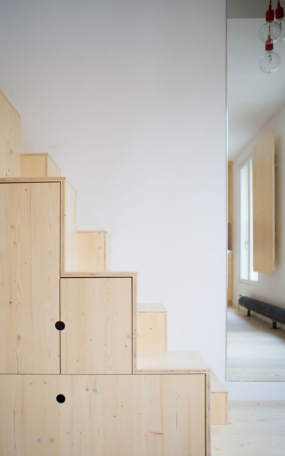 Schemaa-Paris-Apartment_12 Storage Cabinets Under Wood Stairs