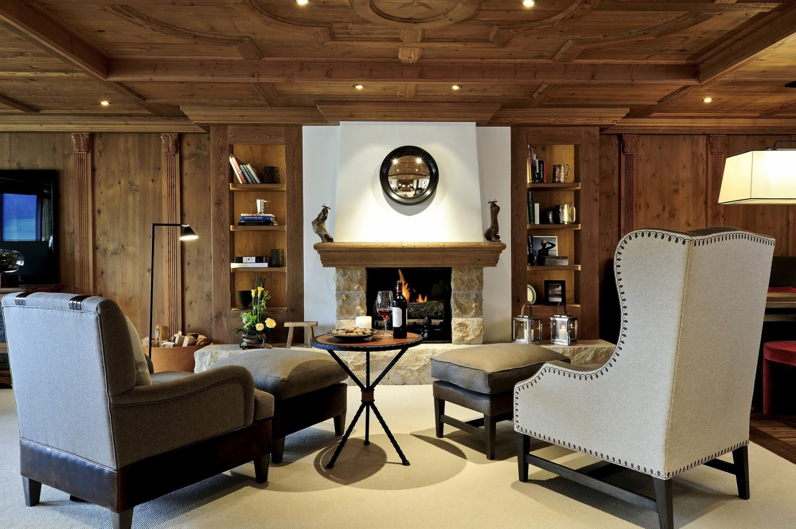 The-Alpina-Gstaad_11 Stone Fireplace with Wood Mantel and Wood Panel Walls & Ceilings