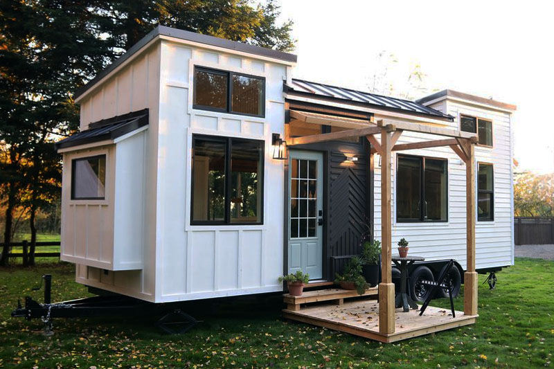 Charming Tiny House Trailer with Board & Batten Siding and Cedar Deck Porch Tiny House with Curb Appeal
